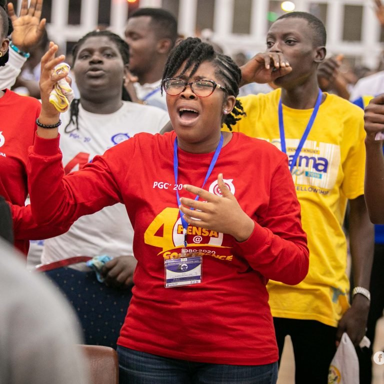 Young Pentecost members worshipping together at a Church conference