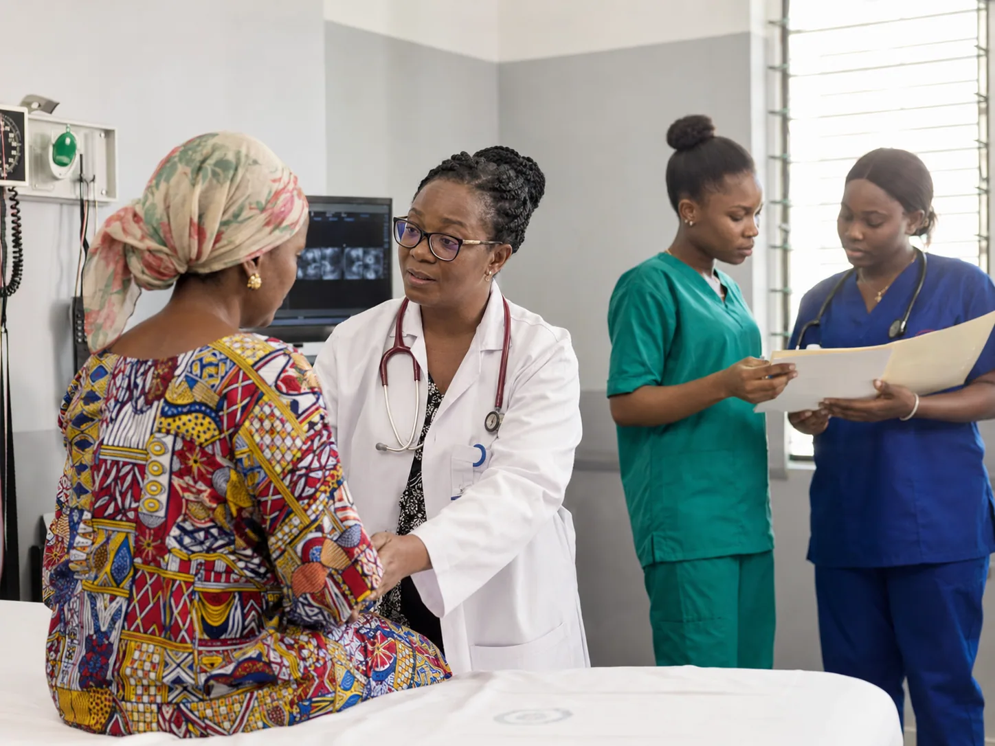 Health professionals caring for a patient in a clinical setting